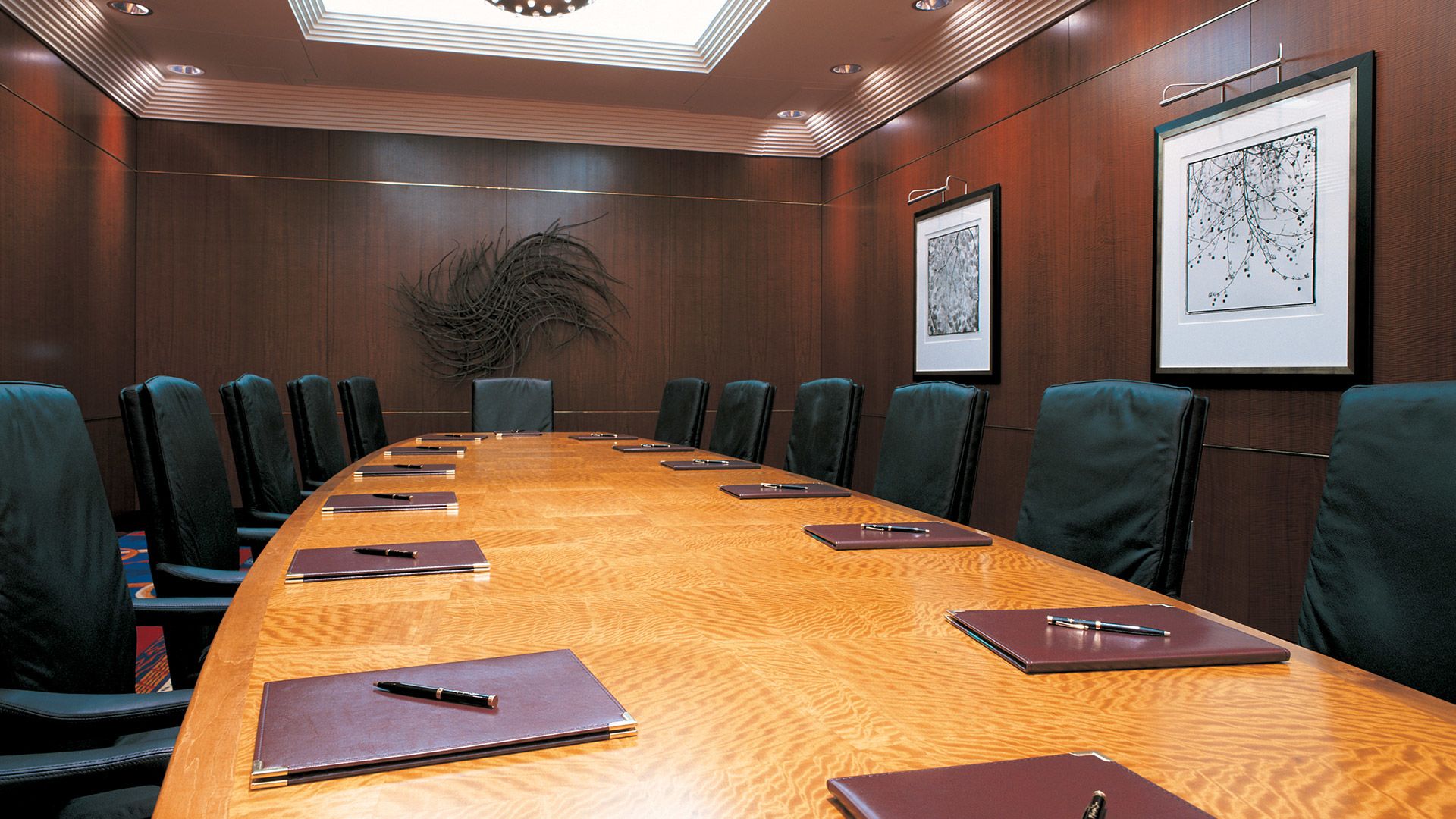 A Conference Room With A Table And Chairs